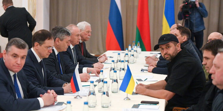 GOMEL REGION, BELARUS - FEBRUARY 28, 2022: Russian State Duma member Leonid Slutsky, President Putin's adviser Vladimir Medinsky, Russia's Deputy Minister of Foreign Affairs Andrei Rudenko, Russia's Deputy Defence Minister Alexander Fomin (from L seated) and Ukrainian Parliament member Davyd Arakhamia (3rd R seated) are seen during Russian-Ukrainian talks. On 27 February, an agreement was reached with the Ukrainian side about talks in the Gomel Region of Belarus in connection with the Russian military operation in Ukraine. Early on 24 February, Russia's President Putin announced his decision to launch a special military operation after considering requests from the leaders of the Donetsk People's Republic and Lugansk People's Republic. Alexander Kryazhev/POOL/TASS.No use Russia.