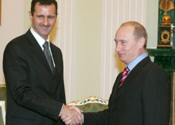 Russian President Vladimir Putin, right,  and his Syrian counterpart Bashar Assad smile as they shake hands in Moscow's Kremlin, Tuesday, Dec. 19, 2006. Russian President Vladimir Putin on Tuesday hosted his Syrian counterpart Bashar Assad for talks focusing on tensions among the Palestinians, Lebanon's political standoff and the stalled Middle East peacemaking _ part of Moscow's efforts to bolster its role in the region amid escalating crises. (AP Photo/ Sergei Karpukhin, pool )