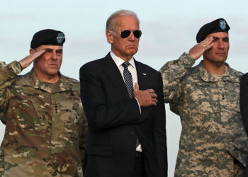 Vice President Joe Biden is flanked by Army Chief of Staff Gen. Mark Milley (left) and Major Gen. Andrew P. Poppas at Dover Air Force Base in Delaware on Nov. 15, 2016. Alex Wong/Getty Images