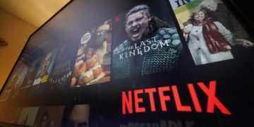 The Netflix menu is shown on a screen in Pittsburgh, on Monday, Oct. 17, 2022. Netflix posted its third quarter results a few weeks before the company launches a cheaper version of its video streaming service that will include ads for the first time, a shift that the company is hoping will accelerate its growth again. (AP Photo/Gene J. Puskar)